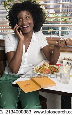 Stock Photo - a young woman 
her 20's wearing 
in a white short 
sleeve top and 
green. fotosearch 
- search stock 
photos, pictures, 
images, and photo 
clipart