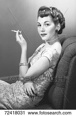 Stock Photography - elegant woman 
smoking cigarette 
in studio, (b&w), 
portrait. fotosearch 
- search stock 
photos, pictures, 
images, and photo 
clipart