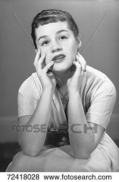 Stock Photo - pensive woman 
in white dress 
posing in studio, 
(b&w), portrait. 
fotosearch - search 
stock photos, 
pictures, images, 
and photo clipart