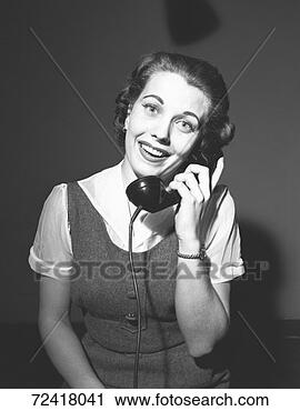 Stock Photography - smiling woman 
talking on phone, 
(b&w), portrait. 
fotosearch - search 
stock photos, 
pictures, images, 
and photo clipart