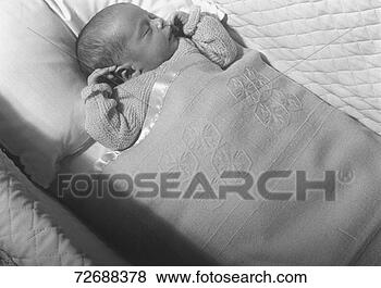 Stock Photo - baby (0-3 months) 
lying in crib, 
sleeping, (b&w), 
elevated view. 
fotosearch - search 
stock photos, 
pictures, images, 
and photo clipart