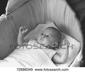 Stock Photograph - baby (3-6 months) 
lying in crib, 
(b&w), elevated 
view. fotosearch 
- search stock 
photos, pictures, 
images, and photo 
clipart