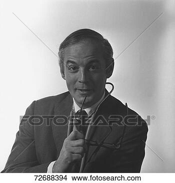Stock Photo - doctor in full 
suit posing in 
studio, (b&w), 
portrait. fotosearch 
- search stock 
photos, pictures, 
images, and photo 
clipart