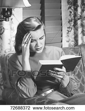 Stock Photo - woman reading 
book, touching 
forehead, (b&w). 
fotosearch - search 
stock photos, 
pictures, images, 
and photo clipart