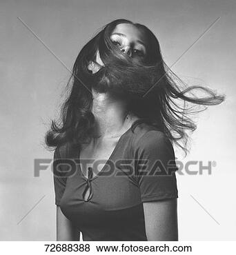 Stock Photo - young woman shaking 
head in studio, 
(b&w), portrait. 
fotosearch - search 
stock photos, 
pictures, images, 
and photo clipart