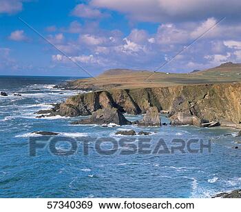 Stock Photograph - ocean waves crashing 
on a rocky cliff. 
fotosearch - search 
stock photos, 
pictures, images, 
and photo clipart