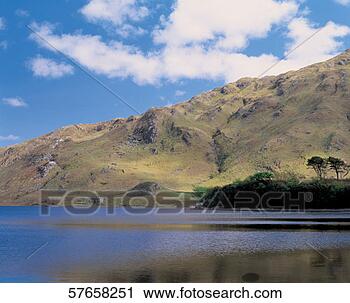 Stock Photography - panoramic view 
of mountains and 
a lake. fotosearch 
- search stock 
photos, pictures, 
images, and photo 
clipart