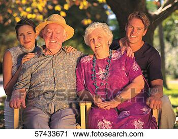 Stock Photography - portrait of a 
mature couple 
and a young couple 
posing. fotosearch 
- search stock 
photos, pictures, 
images, and photo 
clipart