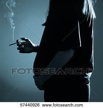 Stock Photo - black and white 
view of a pregnant 
woman with one 
hand on her boom. 
fotosearch - search 
stock photos, 
pictures, images, 
and photo clipart