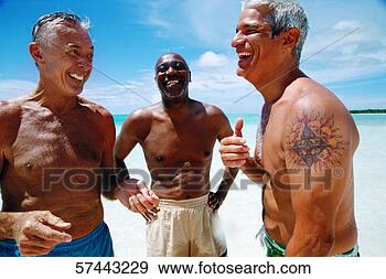 Stock Photograph - portrait of three 
elderly men laughing 
together on the 
beach. fotosearch 
- search stock 
photos, pictures, 
images, and photo 
clipart