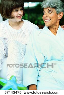 Stock Image - view of a girl 
(8-10) looking 
into her grandmothers 
eyes and smiling. 
fotosearch - search 
stock photos, 
pictures, images, 
and photo clipart