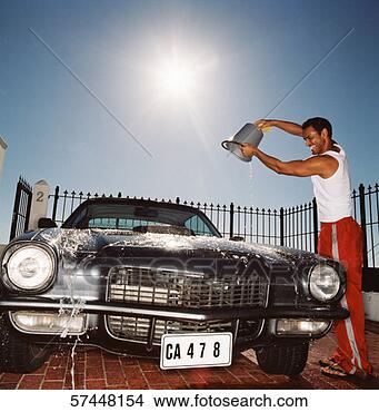 Stock Photo - side profile of 
a man smiling 
and throwing a 
bucket of water 
on a. fotosearch 
- search stock 
photos, pictures, 
images, and photo 
clipart