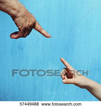Stock Photo - view of the index 
finger of an elderly 
person and a young 
person. fotosearch 
- search stock 
photos, pictures, 
images, and photo 
clipart