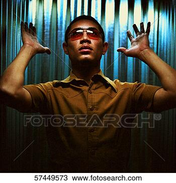Stock Photo - portrait of a 
man wearing sunglasses 
with her arms 
out. fotosearch 
- search stock 
photos, pictures, 
images, and photo 
clipart