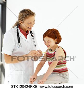 Stock Photo - female medical 
personnel examining 
a little girl. 
fotosearch - search 
stock photos, 
pictures, images, 
and photo clipart