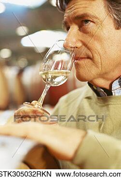 Stock Photo - close-up of a 
mature man drinking 
white wine. fotosearch 
- search stock 
photos, pictures, 
images, and photo 
clipart