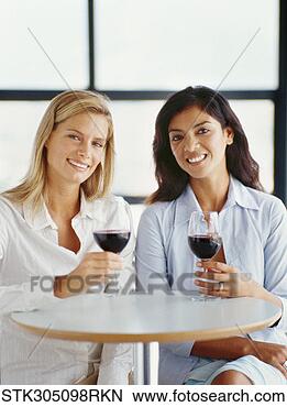 Stock Photo - portrait of two 
young women holding 
wineglasses. fotosearch 
- search stock 
photos, pictures, 
images, and photo 
clipart