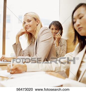 Stock Photography - three businesswomen 
sitting in a conference 
room. fotosearch 
- search stock 
photos, pictures, 
images, and photo 
clipart