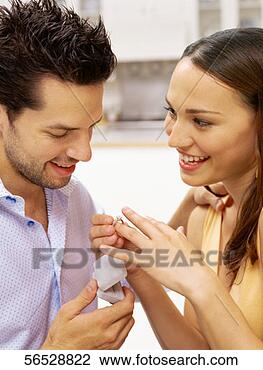 Stock Photo - close-up of a 
young woman trying 
on an engagement 
ring. fotosearch 
- search stock 
photos, pictures, 
images, and photo 
clipart