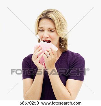 Stock Photography - young woman sneezing 
into a tissue 
paper. fotosearch 
- search stock 
photos, pictures, 
images, and photo 
clipart