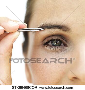 Stock Photo - close-up of a 
woman tweezing 
her eyebrow. fotosearch 
- search stock 
photos, pictures, 
images, and photo 
clipart