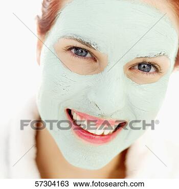 Stock Photo - close-up of a 
young woman wearing 
a facial mask. 
fotosearch - search 
stock photos, 
pictures, images, 
and photo clipart