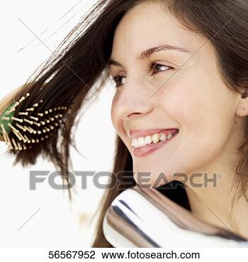 Banco de Imagem - jovem,  mulher, 
 sopro,  secar, 
 dela,  cabelo. 
fotosearch - busca 
de fotos, imagens 
e clipart