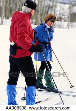 Stock Photo - couple enjoying 
a break from cross-country 
skiing. fotosearch 
- search stock 
photos, pictures, 
images, and photo 
clipart