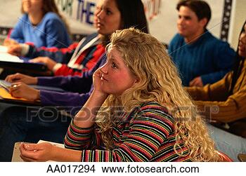 Stock Photo - bored teenage 
girl daydreaming 
in class. fotosearch 
- search stock 
photos, pictures, 
images, and photo 
clipart