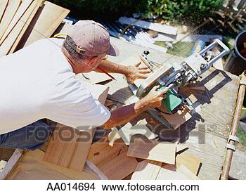 Stock Photo - construction worker 
using a circular 
saw. fotosearch 
- search stock 
photos, pictures, 
images, and photo 
clipart