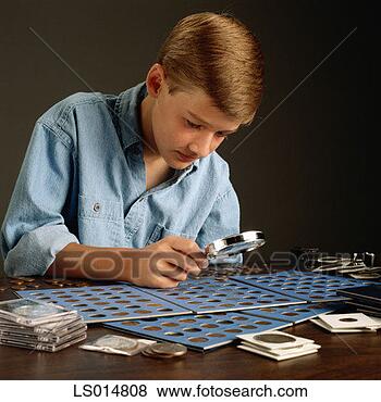 Stock Photo - boy examining 
coin collection. 
fotosearch - search 
stock photos, 
pictures, images, 
and photo clipart
