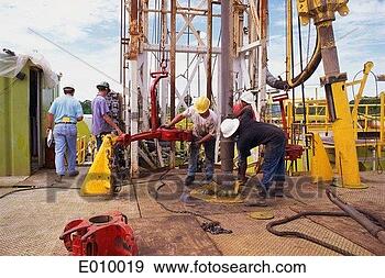 Stock Photograph - crew working on 
oil rig. fotosearch 
- search stock 
photos, pictures, 
images, and photo 
clipart
