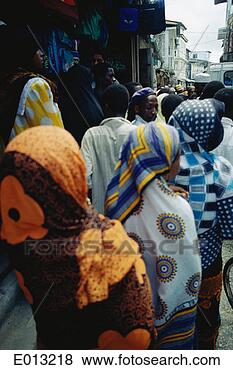 Stock Photo - people walking 
through street 
in zanzibar, tanzania. 
fotosearch - search 
stock photos, 
pictures, images, 
and photo clipart