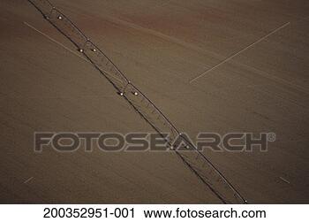 Stock Photography - irrigation sprayer 
in farm field, 
 aerial view, 
 early spring. 
fotosearch - search 
stock photos, 
pictures, images, 
and photo clipart