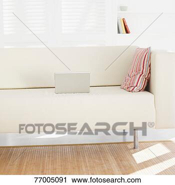 Stock Photography - laptop on couch 
in living room. 
fotosearch - search 
stock photos, 
pictures, images, 
and photo clipart