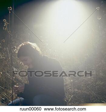 Stock Photography - woman, spring 
awakening, grass, 
portrait, young, 
beautiful, light. 
fotosearch - search 
stock photos, 
pictures, images, 
and photo clipart