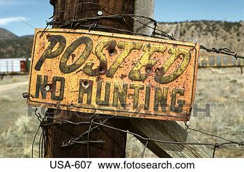 Picture - 'no hunting' sign 
on fence post 
colorado. fotosearch 
- search stock 
photos, pictures, 
images, and photo 
clipart