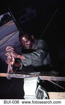 Stock Photo - mechanic working 
metal in a vice 
zimbabwe. fotosearch 
- search stock 
photos, pictures, 
images, and photo 
clipart