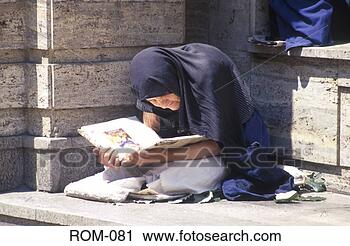 Stock Photography - crouched old woman 
reading a book 
bucharest romania. 
fotosearch - search 
stock photos, 
pictures, images, 
and photo clipart