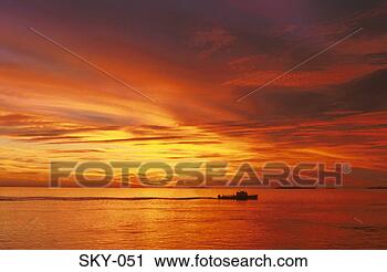 Stock Photography - silhouetted ship 
against sunset. 
fotosearch - search 
stock photos, 
pictures, images, 
and photo clipart