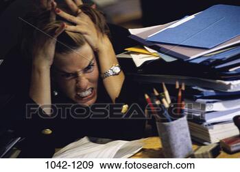 Stock Photograph - desk, woman, anger, 
paperwork, stress, 
business, frustrated. 
fotosearch - search 
stock photos, 
pictures, images, 
and photo clipart