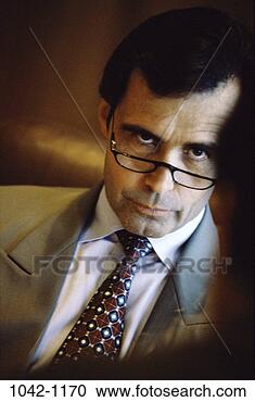 Stock Photography - eyeglasses, business, 
confrontation, 
middle-aged, executives, 
serious. fotosearch 
- search stock 
photos, pictures, 
images, and photo 
clipart