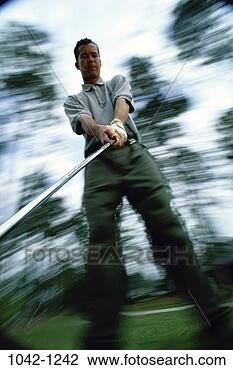 Stock Photo - golf, concentration, 
swinging, swing, 
concentrating, 
motion. fotosearch 
- search stock 
photos, pictures, 
images, and photo 
clipart