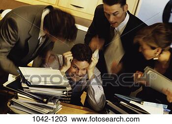 Stock Photo - group, desk, anger, 
overwhelmed, stress, 
business. fotosearch 
- search stock 
photos, pictures, 
images, and photo 
clipart