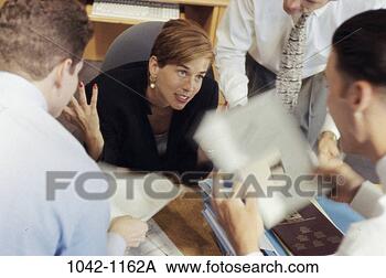 Stock Photo - meeting, group, 
desk, coworkers, 
talking, discussion. 
fotosearch - search 
stock photos, 
pictures, images, 
and photo clipart