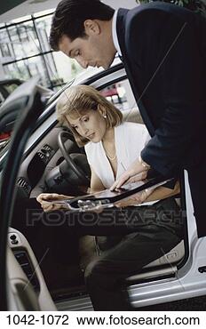 Stock Photo - people, car, reading, 
shopping, salesman, 
automotive. fotosearch 
- search stock 
photos, pictures, 
images, and photo 
clipart