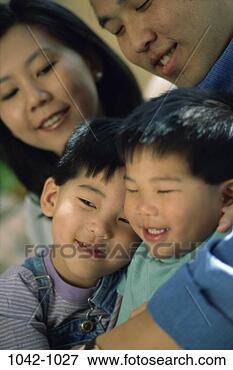 Picture - people, smiling, 
asian, sitting, 
mother, two, hugging. 
fotosearch - search 
stock photos, 
pictures, images, 
and photo clipart