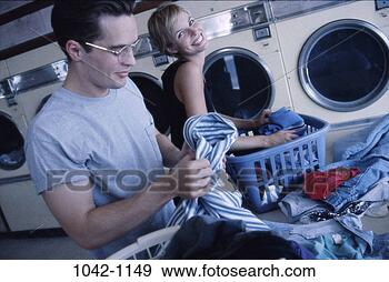 Stock Photograph - people, smiling, 
couple, playful, 
smile, clothes. 
fotosearch - search 
stock photos, 
pictures, images, 
and photo clipart