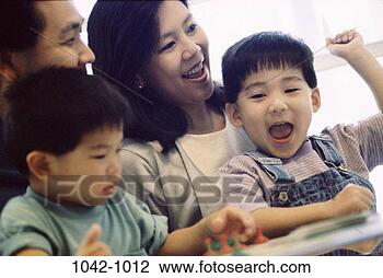 Stock Photo - people, smiling, 
playing, success, 
asian, raised. 
fotosearch - search 
stock photos, 
pictures, images, 
and photo clipart