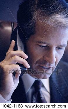 Stock Photo - telephone, talking, 
phone, business, 
middle-aged, serious. 
fotosearch - search 
stock photos, 
pictures, images, 
and photo clipart
